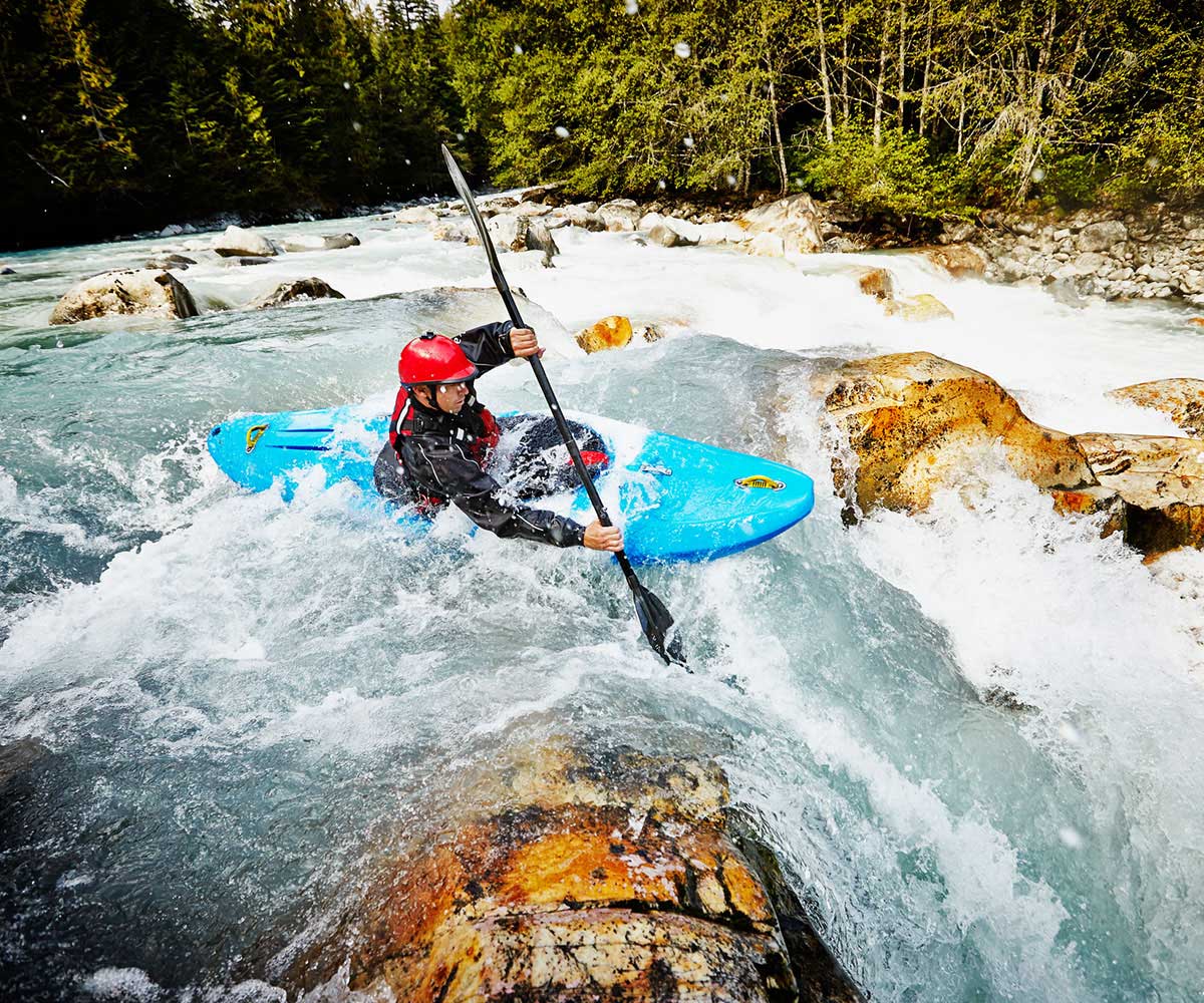 Man in rough waters in a kayak