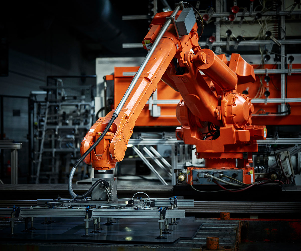 orange mechanical machinery in warehouse