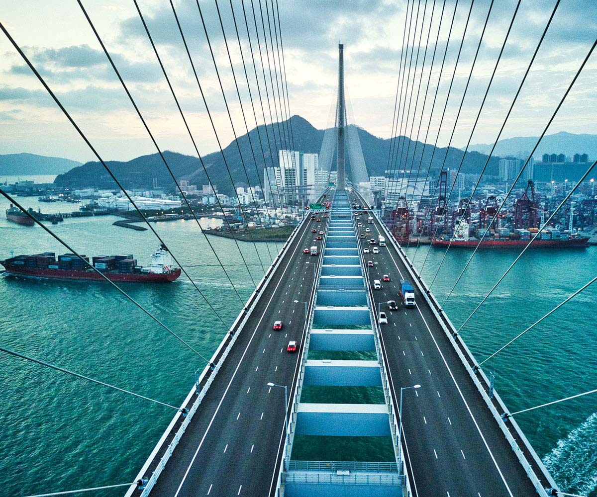Bridge crossing port harbour in Asia